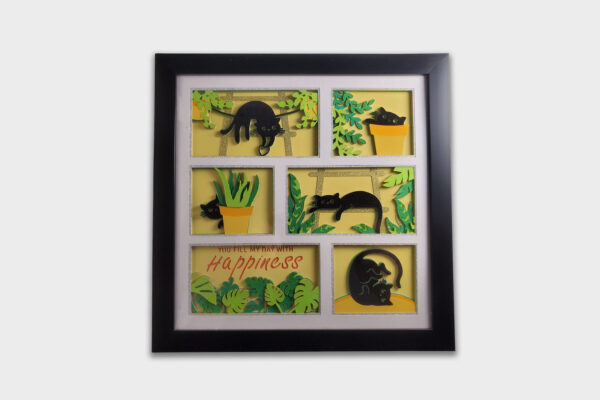 Vibrant 3D shadow box featuring layered black cat silhouettes, green leaves, and yellow planters on a cheery backdrop. A black frame encloses the phrase “You fill my day with Happiness.” Perfect for cat lovers and brightening any room. Great gift!