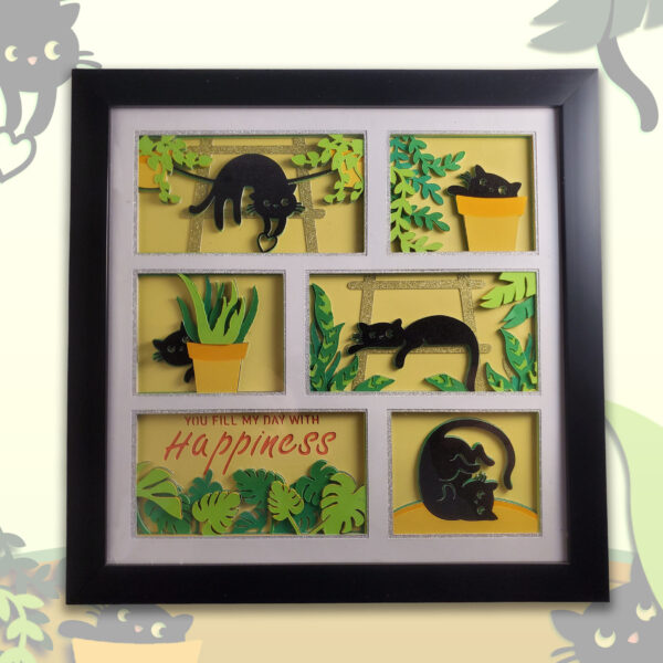 Thumbnail image of layered black cat shadow box with yellow background and greenery.